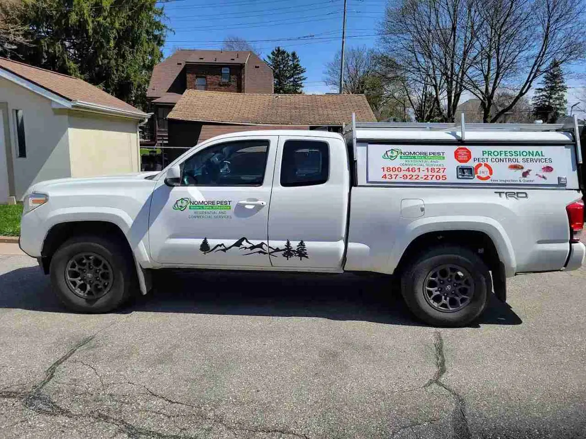 Nomore Pest service truck parked at a customer's home